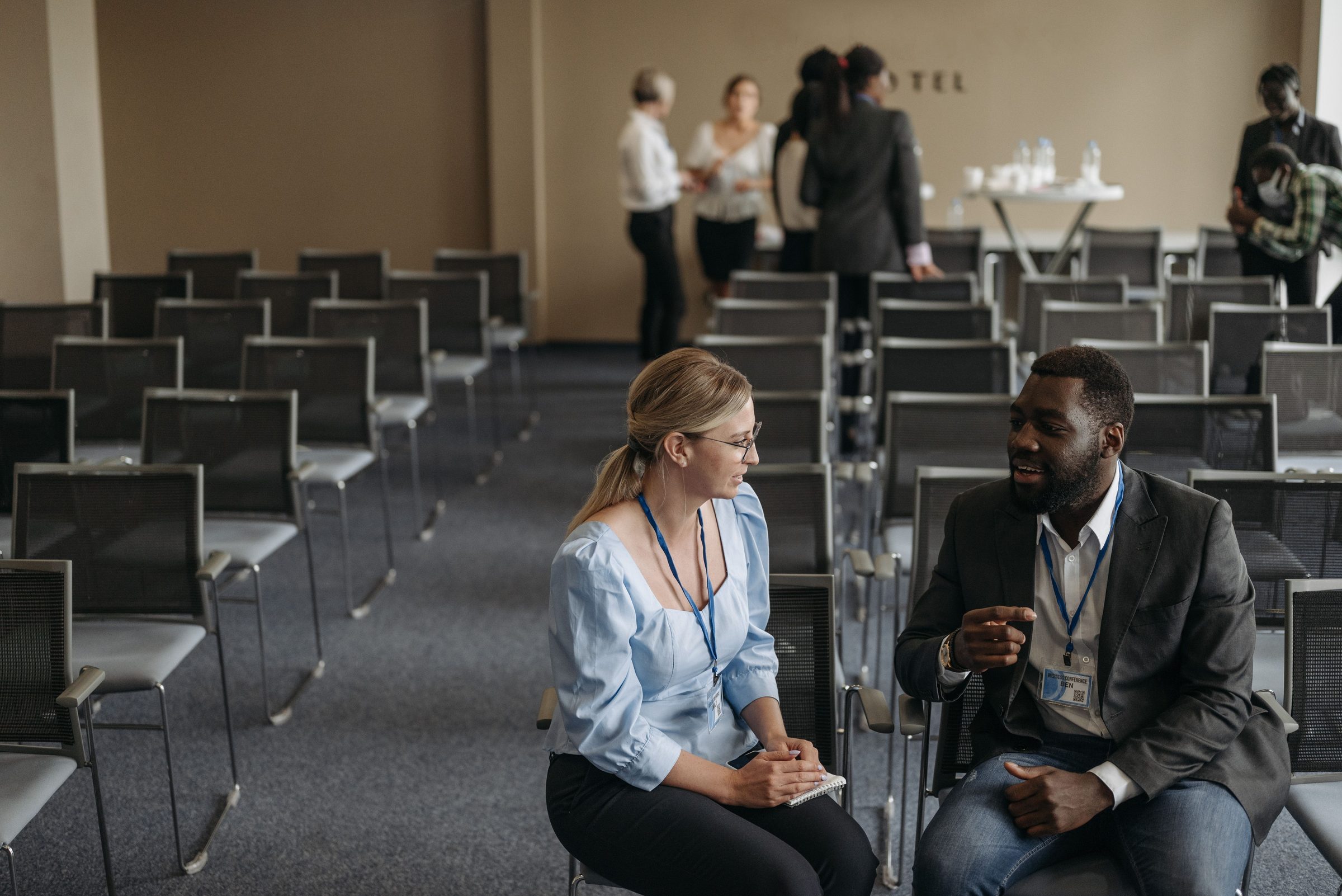Corporate conference setup with attendees networking